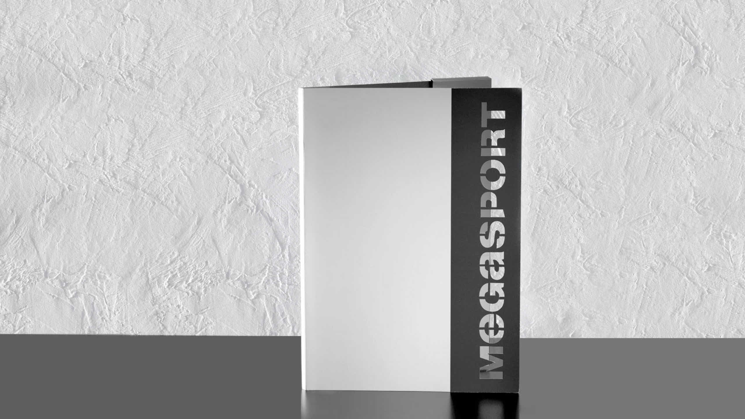 <span><span>Libreta corporativa de la marca MEGASPORT. Dise&ntilde;ado por el estudio esiete de branding y comunicaci&oacute;n.</span></span>